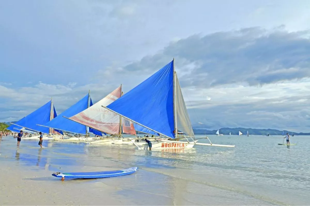 Boracay Paraw sail boats ready on the beach to take you island hopping