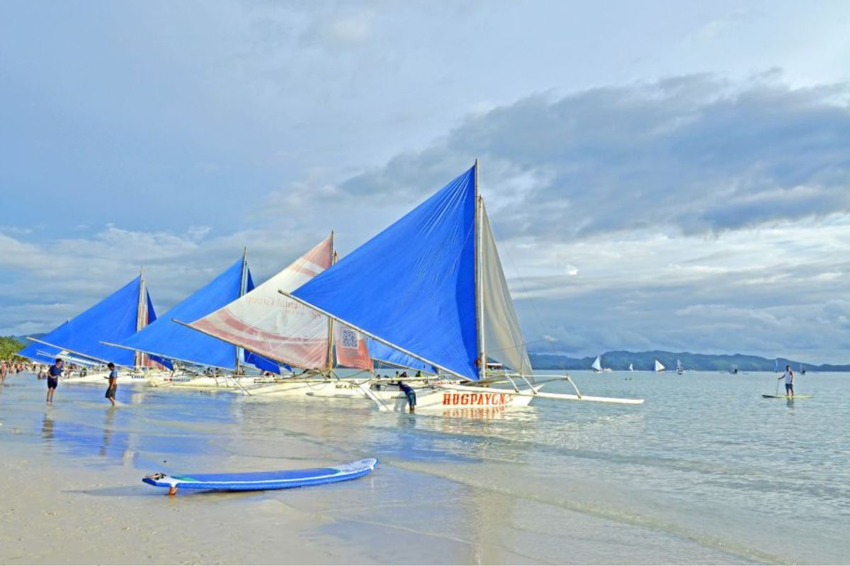 Boracay Paraw sail boats ready on the beach to take you island hopping
