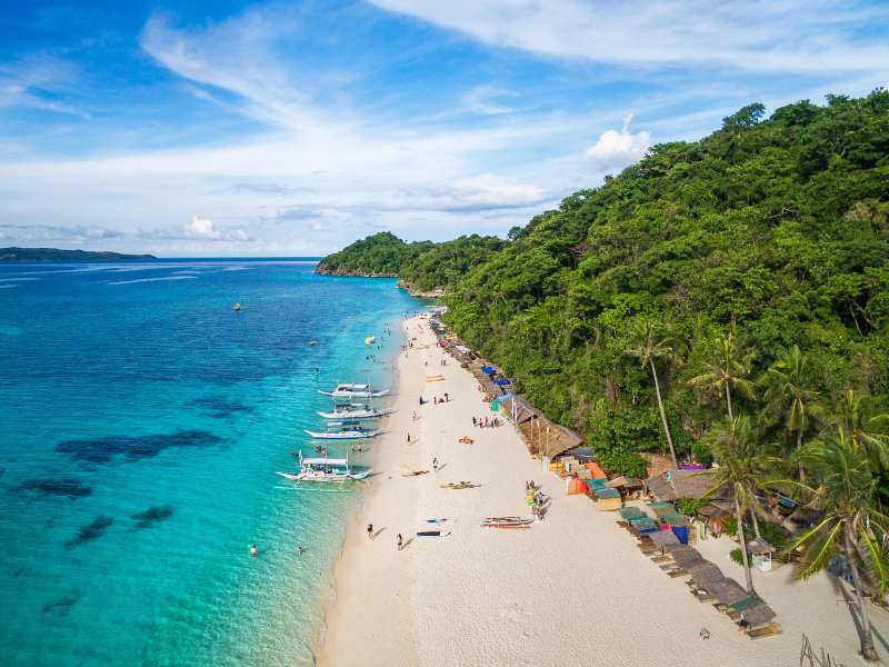 Stunning aerial view of Puka beach, the perfect dropoff on your island hopping day