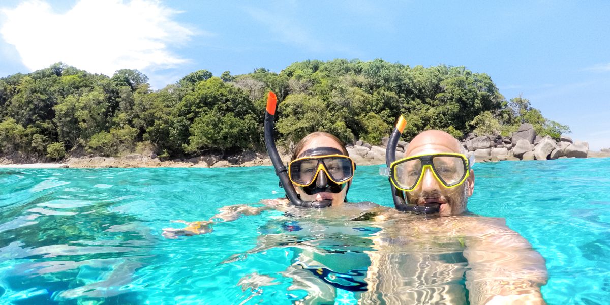 Couple snorkeling off an island in Boracay on a day activity